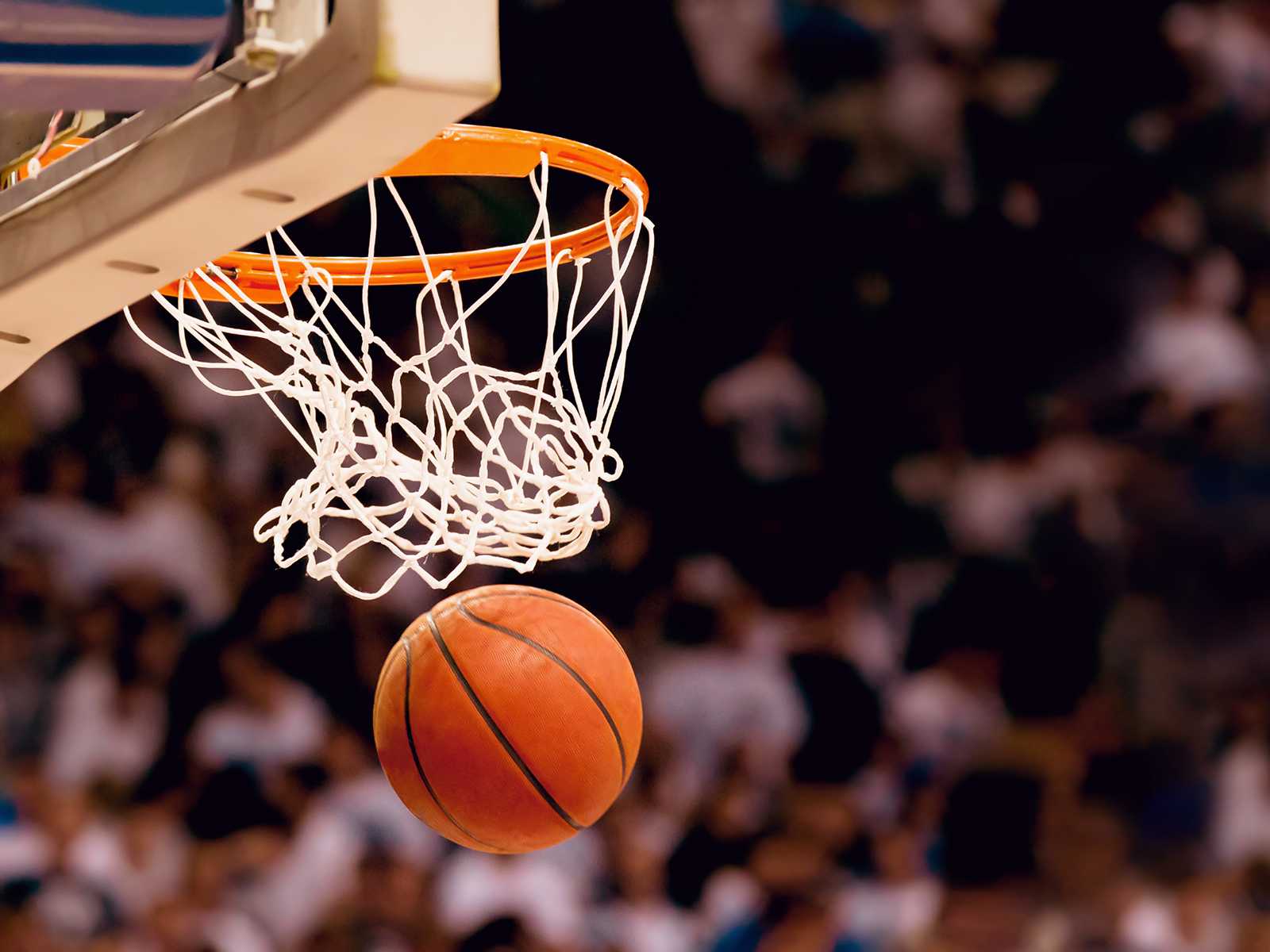 Basketball going through the hoop